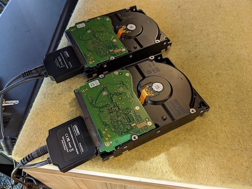 a picture of two hard drives with cables connected